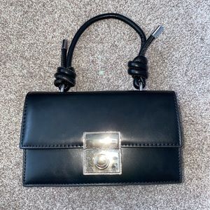 Never used. Can be used as crossbody or Handbag